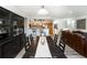 Dining room with a dark wood table, chairs and a built-in hutch at 3851 Stonebrush Dr # 11B, Littleton, CO 80126