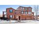 Three-story stucco home with three-car garage at 3851 Stonebrush Dr # 11B, Littleton, CO 80126