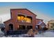 Three-story stucco home with balcony and patio at 3851 Stonebrush Dr # 11B, Littleton, CO 80126