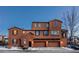 Three-story stucco home with three-car garage at 3851 Stonebrush Dr # 11B, Littleton, CO 80126
