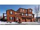 Three-story stucco home with three-car garage at 3851 Stonebrush Dr # 11B, Littleton, CO 80126