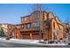 Beautiful three-story home with three-car garage and mature trees at 3851 Stonebrush Dr # 11B, Littleton, CO 80126