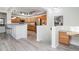 Open kitchen with island, stainless steel appliances, and wood cabinets at 3851 Stonebrush Dr # 11B, Littleton, CO 80126
