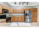 Modern kitchen featuring stainless steel appliances and ample cabinetry at 3851 Stonebrush Dr # 11B, Littleton, CO 80126
