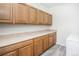 Laundry room with ample storage and countertop space at 3851 Stonebrush Dr # 11B, Littleton, CO 80126