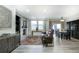 Open living and dining area with stone fireplace and hardwood floors at 3851 Stonebrush Dr # 11B, Littleton, CO 80126
