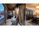 Private patio with two wicker chairs, offering views of the surrounding neighborhood at 3851 Stonebrush Dr # 11B, Littleton, CO 80126