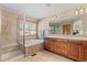 Spacious bathroom with a soaking tub, shower, double vanity and big mirror at 16223 River Haven Way, Morrison, CO 80465