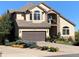 Close-up exterior of a charming home featuring a two-car garage and well-manicured landscaping at 16223 River Haven Way, Morrison, CO 80465