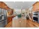 Well-equipped kitchen offers granite countertops, stainless steel appliances, and an island, flowing into the adjacent living spaces at 16223 River Haven Way, Morrison, CO 80465