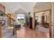 A welcoming living room with hardwood floors, large windows and a view of the outdoor landscape at 16223 River Haven Way, Morrison, CO 80465