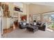 An expansive living room with soaring ceilings, lots of natural light, and an open floor plan at 16223 River Haven Way, Morrison, CO 80465