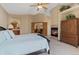 Comfortable main bedroom features a fireplace, spacious layout, and access to an ensuite bathroom, perfect for relaxation and privacy at 16223 River Haven Way, Morrison, CO 80465