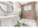 Neutral bathroom with granite-look sink and marble tiling in shower and tub area at 17753 E Nassau Pl, Aurora, CO 80013