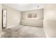 Neutral carpeted bedroom featuring natural light from the window and light colored walls at 17753 E Nassau Pl, Aurora, CO 80013