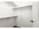 Empty white closet with shelving and hardwood floors at 17753 E Nassau Pl, Aurora, CO 80013