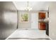 Bright eat in kitchen features a modern chandelier and tile floors at 17753 E Nassau Pl, Aurora, CO 80013