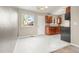 Bright eat in kitchen features a modern chandelier and tile floors at 17753 E Nassau Pl, Aurora, CO 80013