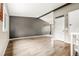 Bright living room featuring light wood floors, neutral walls, and staircase at 17753 E Nassau Pl, Aurora, CO 80013