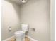Standard toilet in a small neutral colored bathroom at 17753 E Nassau Pl, Aurora, CO 80013