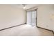 Bedroom featuring carpet, a ceiling fan, a sliding glass door to a balcony and white walls at 6670 W 84Th Cir # 99, Arvada, CO 80003