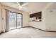 Living room with sliding glass doors that lead to the balcony and open kitchen at 6670 W 84Th Cir # 99, Arvada, CO 80003