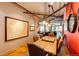 Spacious dining room with hardwood floors, a wooden dining table, and exposed ductwork on the ceiling at 1863 Wazee St # 4B, Denver, CO 80202