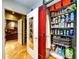 A well-organized laundry room featuring a washer/dryer and shelving for cleaning supplies and storage at 1863 Wazee St # 4B, Denver, CO 80202