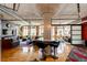 Expansive living room with exposed concrete beams, hardwood flooring, and modern seating at 1863 Wazee St # 4B, Denver, CO 80202