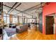 Bright and airy living room with hardwood floors, exposed ductwork, and large windows at 1863 Wazee St # 4B, Denver, CO 80202