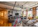 Cozy living room with a comfortable seating area, a modern entertainment center, and hardwood floors at 1863 Wazee St # 4B, Denver, CO 80202