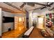 Main bedroom featuring wood floors, concrete ceiling and a view into the bathroom at 1863 Wazee St # 4B, Denver, CO 80202