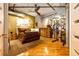A cozy main bedroom with wood floors, concrete ceiling and personal fitness equipment at 1863 Wazee St # 4B, Denver, CO 80202
