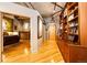 Spacious main bedroom featuring wood floors, concrete ceiling and a view into the living area at 1863 Wazee St # 4B, Denver, CO 80202