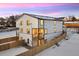 Back exterior view of two-story home with deck and fenced yard at 4660 W 9Th Ave, Denver, CO 80204