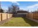 Landscaped backyard with wood fence and gravel border at 4660 W 9Th Ave, Denver, CO 80204