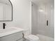 Modern bathroom with a walk-in shower and gray tile at 4660 W 9Th Ave, Denver, CO 80204