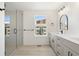 Modern bathroom with double vanity, large shower, and stylish fixtures at 4660 W 9Th Ave, Denver, CO 80204