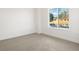 Bright bedroom featuring a large window and carpeted floors at 4660 W 9Th Ave, Denver, CO 80204