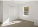 Well-lit bedroom featuring double door closet and carpeted floor at 4660 W 9Th Ave, Denver, CO 80204