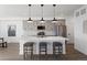 Modern kitchen with gray cabinets, white quartz countertops, and stainless steel appliances at 4660 W 9Th Ave, Denver, CO 80204