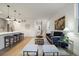 Living room with dark gray sofa and hardwood floors at 4660 W 9Th Ave, Denver, CO 80204