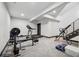 A well-lit basement gym with padded floors and state-of-the-art workout equipment at 5665 Vistancia Ct, Parker, CO 80134