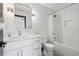 This modern bathroom features an undermount sink and a shower over tub combination with white subway tile at 5665 Vistancia Ct, Parker, CO 80134