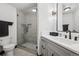 This contemporary bathroom features a glass shower and vanity with modern fixtures at 5665 Vistancia Ct, Parker, CO 80134