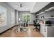 Spacious home office with hardwood floors, built-in shelves, and large windows with modern shutters at 5665 Vistancia Ct, Parker, CO 80134