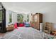 A spacious playroom with lots of natural light and a large cabinet for storage at 5665 Vistancia Ct, Parker, CO 80134