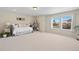 Bright bedroom with two windows overlooking the landscape, and neutral carpeting at 3395 Starry Night Loop, Castle Rock, CO 80109