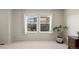 Bright bedroom with two windows overlooking the landscape, and neutral carpeting at 3395 Starry Night Loop, Castle Rock, CO 80109