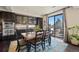 Dining room featuring a wood table, stylish rug, and sliding glass doors to the outdoor patio at 3395 Starry Night Loop, Castle Rock, CO 80109